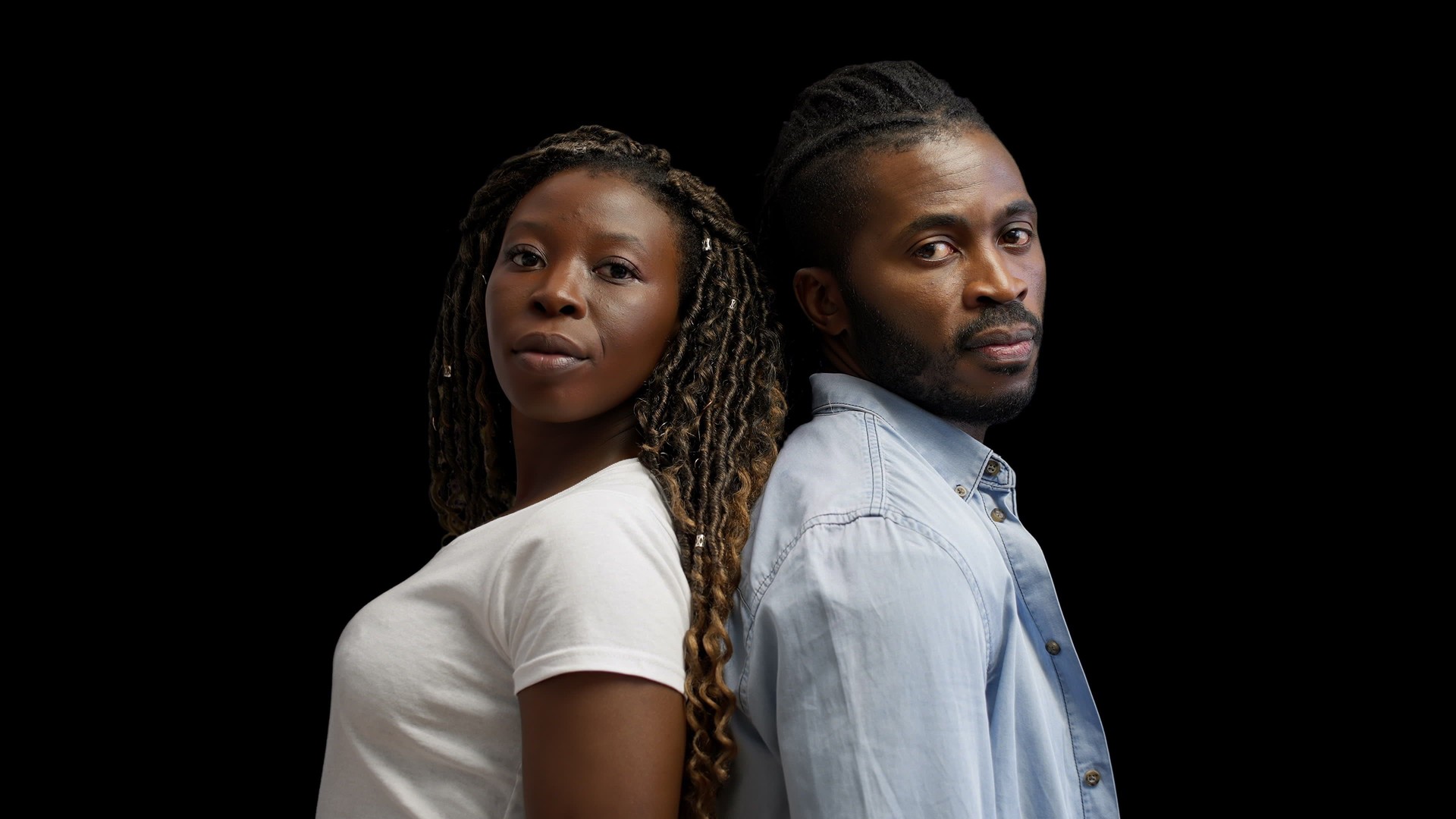 Young African American couple looking at camera, protests, social issue